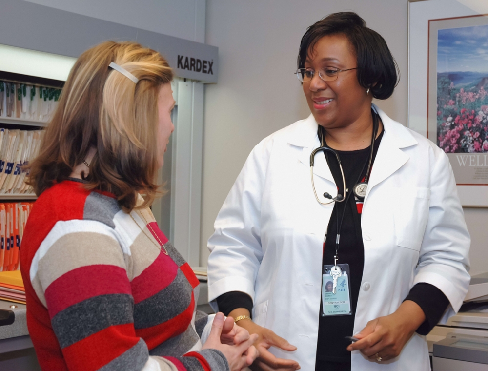 Female doctor with female patient